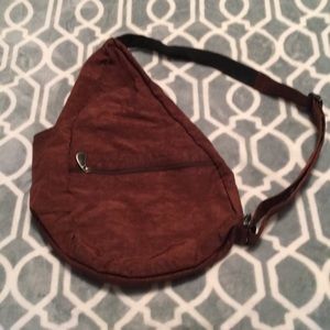 Sturdy washable waterproof shoulder bag.